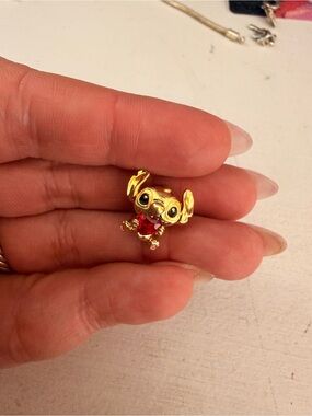 Pandora Gold Stitch Charm with Red Accent